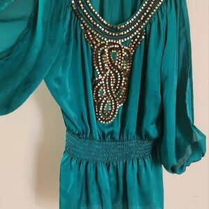 Golden beaded jade color bebe top size XXS